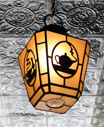 Antique lantern light on original tin ceiling